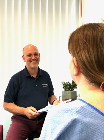 Patient consultation with Jeff Shurr of Preston Chiropractic Associates