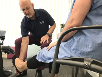 Preston chiropractic's Jeff Shurr treating a woman suffering with lumbar spine stenosis